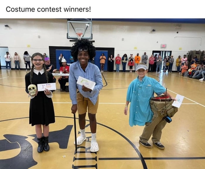 
    How the kid on the right only got third place?